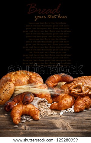 Appetizing croissants on old wooden table