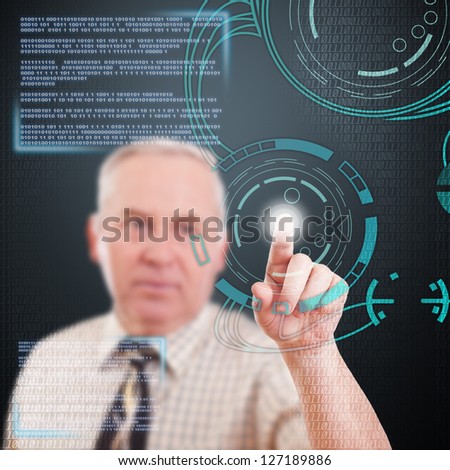 Senior businessman with interface in futuristic interior