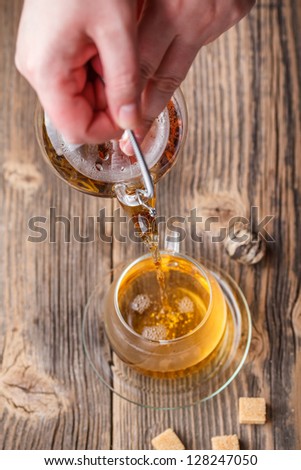 Pouring tea in the cup