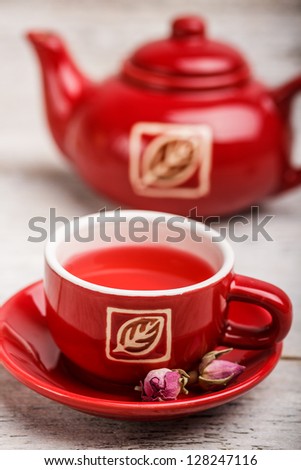 Rose bud tea in red teacup