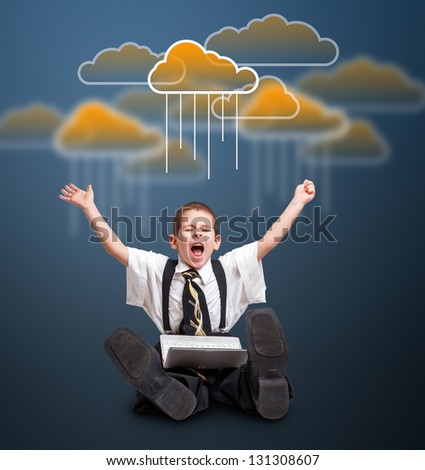 Boy with laptop and cloud computing