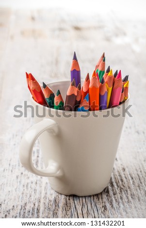Various colour pencils in cup