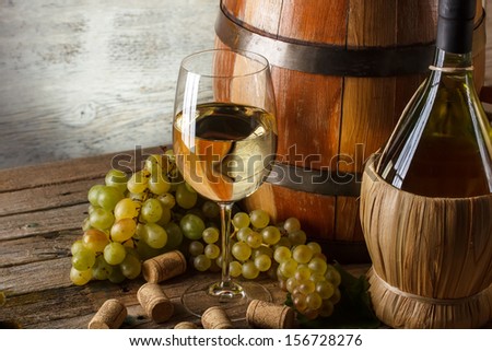Wine concept with fresh grape, goblet and wine bottle