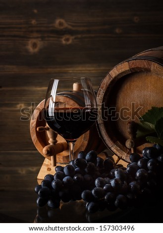 Wine concept with glass and barrel