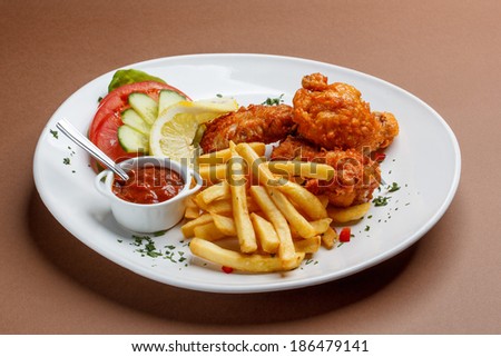 Fried chicken with fries on a plate