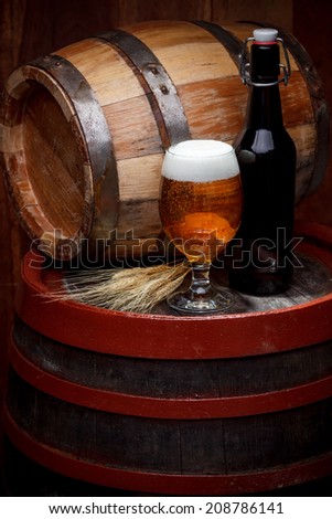Beer keg with glass of beer