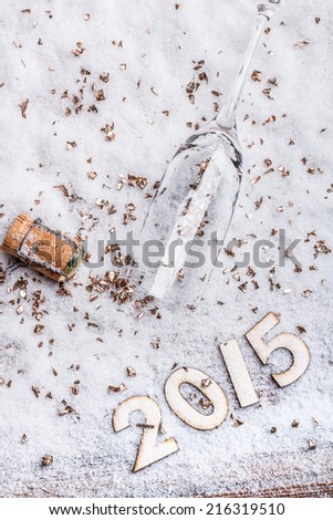 Celebration theme with champagne glass and cork in snow