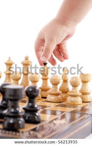 Childre hand with chess, isolated in white
