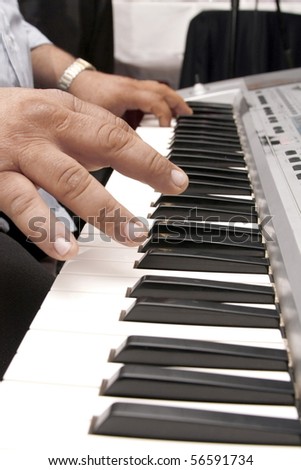 artist hands of a piano player