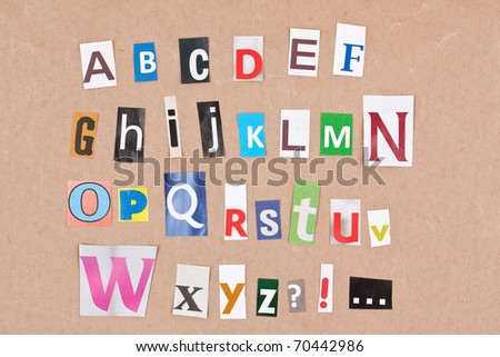 Alphabet, letters sorted on paper background