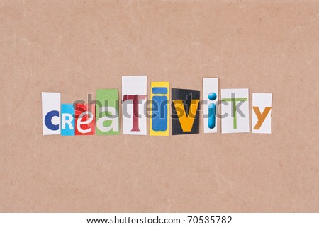 Creativity, letters sorted on paper background