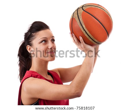 Pretty brunette woman holding Basketball in hand and smiling isolated on a white background