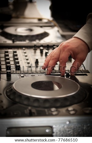 DJ play music with music mixer