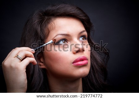 Eyes Makeup. Woman with eye shadow brush