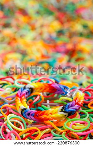 Rainbow bracelet on colorful rubber background
