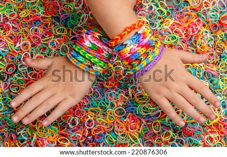 Colorful Rainbow loom bracelet rubber bands fashion on old wood - Stock  Image - Everypixel