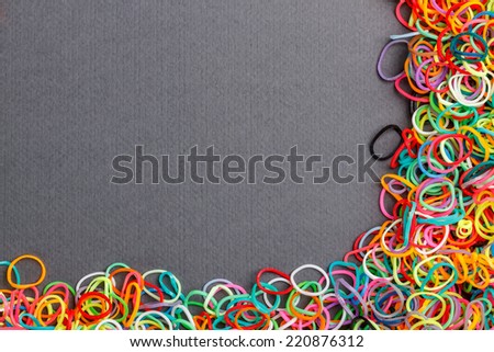 Loom rubber bands frame on gray background