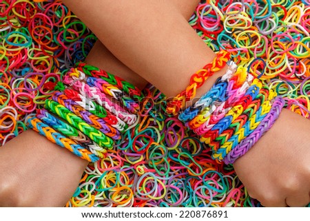 Loom bracelets, colorful rubber in background