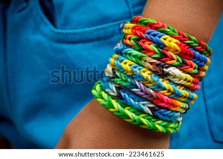 Clolse up of loom bands bracelets on kid hand
