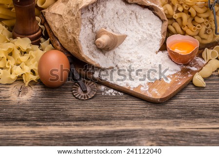 Ingredients for making fresh pasta on rustic wooden board