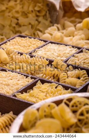 Lots of various pasta in a wooden box