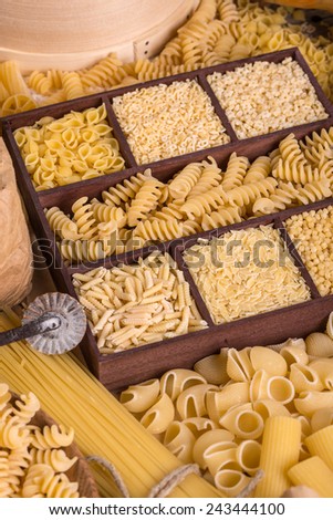 Various types of pasta in wooden box