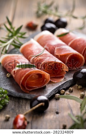 Pork collar ham on flagstone, rustic style