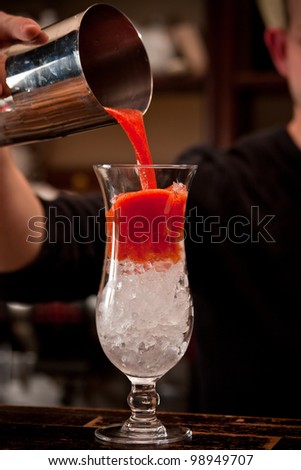 Barman preparing tomato cocktail