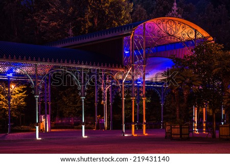KUDOWA ZDROJ, POLAND - August 06, 2014: Spa gardens, concert hall and promenade by night