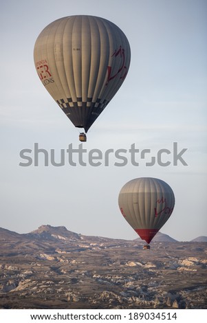 GOREME, TURKEY - APRIL 6: Hot air balloons flying over Cappadocia in Goreme, Turkey on April 6, 2014. The hot air balloon is a major tourist attraction for viewing the region\'s geological landscape.
