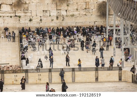JERUSALEM, ISRAEL - MARCH 9: Jews praying at the western wall on March 9, 2014 in Jerusalem, Israel.