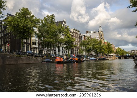 Amsterdam, Netherlands - June 30: View from a boat ride on the water canals of Amsterdam, Netherlands, on June 30, 2014.