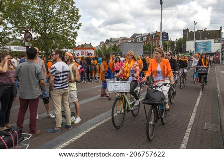 Amsterdam, Netherlands - June 29: People riding bicycles in Amsterdam, Netherlands on June 29, 2014.