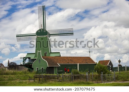 Zaanse Schans, Netherlands - June 30: Traditional dutch windmills at Zaanse Schans, Netherlands on June 30, 2014. Zaanse Schans has a collection of well-preserved historic windmills and houses.