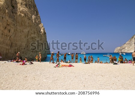 Zakynthos, Greece - June 30: Tourists at the Navagio (Shipwreck) Beach in Zakynthos, Greece on June 30, 2014. Navagio Beach is a popular attraction among tourists visiting the island of Zakynthos.