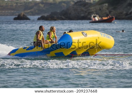 Zakynthos, Greece - June 30: Tourists engaging in water sports activities in Zakynthos, Greece on June 30, 2014.