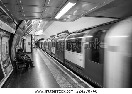 London, England - October 15: Train departing a London Underground station on October 15, 2014.