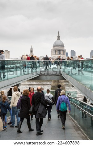 London, England - October 15: Tourists crossing the Millennium Bridge linking the City of London with the South Bank in London, England on October 15, 2014.