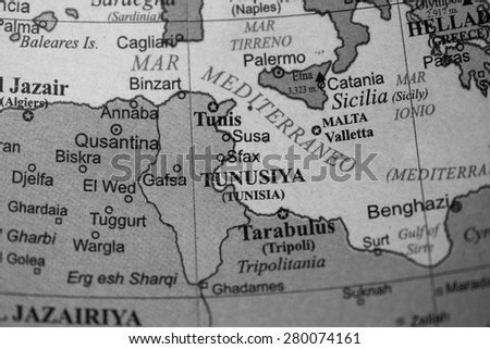 Map view of Tunisia on a geographical globe. (black and white)