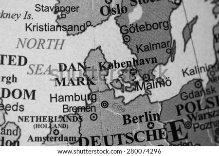 Map view of Denmark on a geographical globe. (black and white)