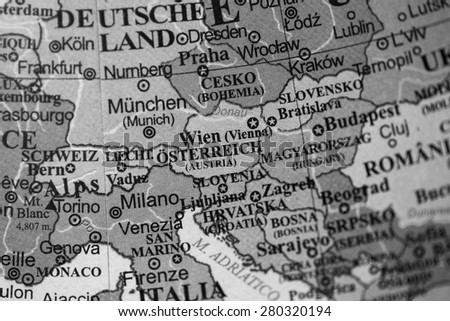 Map view of Austria on a geographical globe. (black and white)