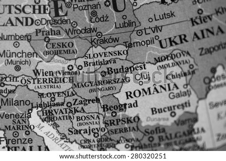 Map view of Hungary on a geographical globe. (black and white)
