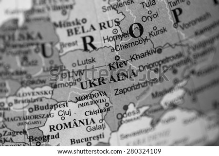 Map view of Ukraine on a geographical globe. (black and white)