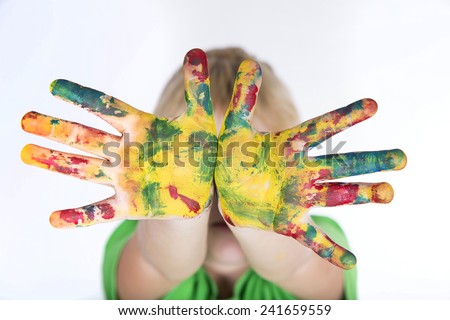 child boy with colorful painted hands