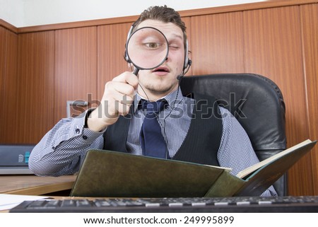 businessman with magnifying glass over white background