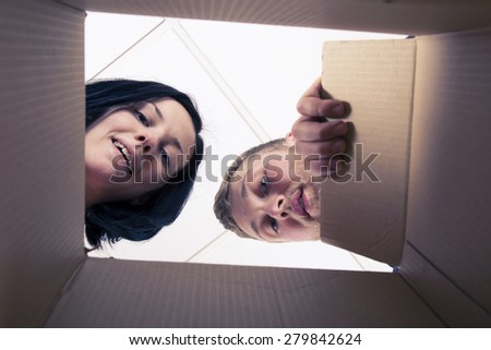 Couple looking inside the box