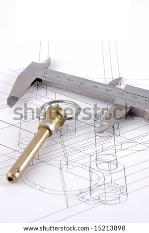 A pip-pin and calipers on a technical drawing