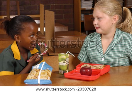 Two students eating lunch, one health, one not