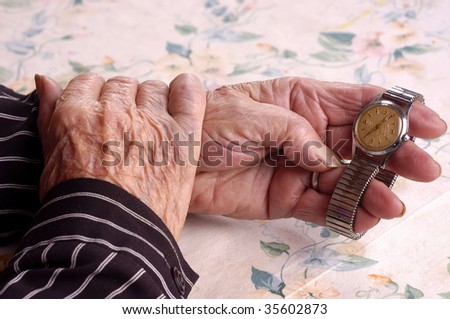 holding a watch