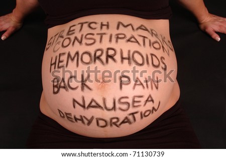 Pregnancy Health risks written on pregnant tummy
